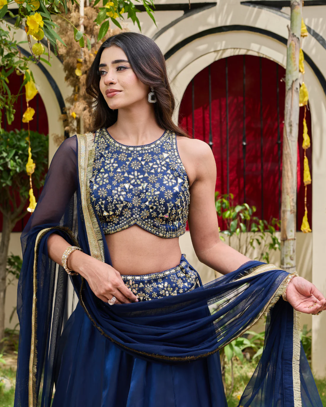 Deepika Chadha - Navy blue blouse and shimmer organza lehnga set From Heer
