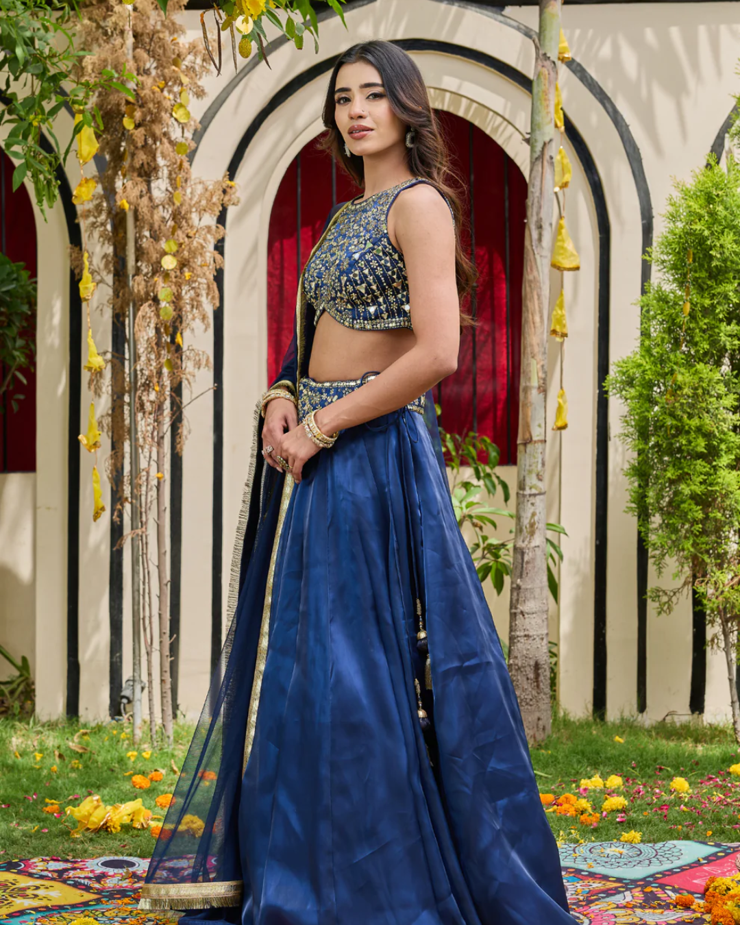 Deepika Chadha - Navy blue blouse and shimmer organza lehnga set From Heer