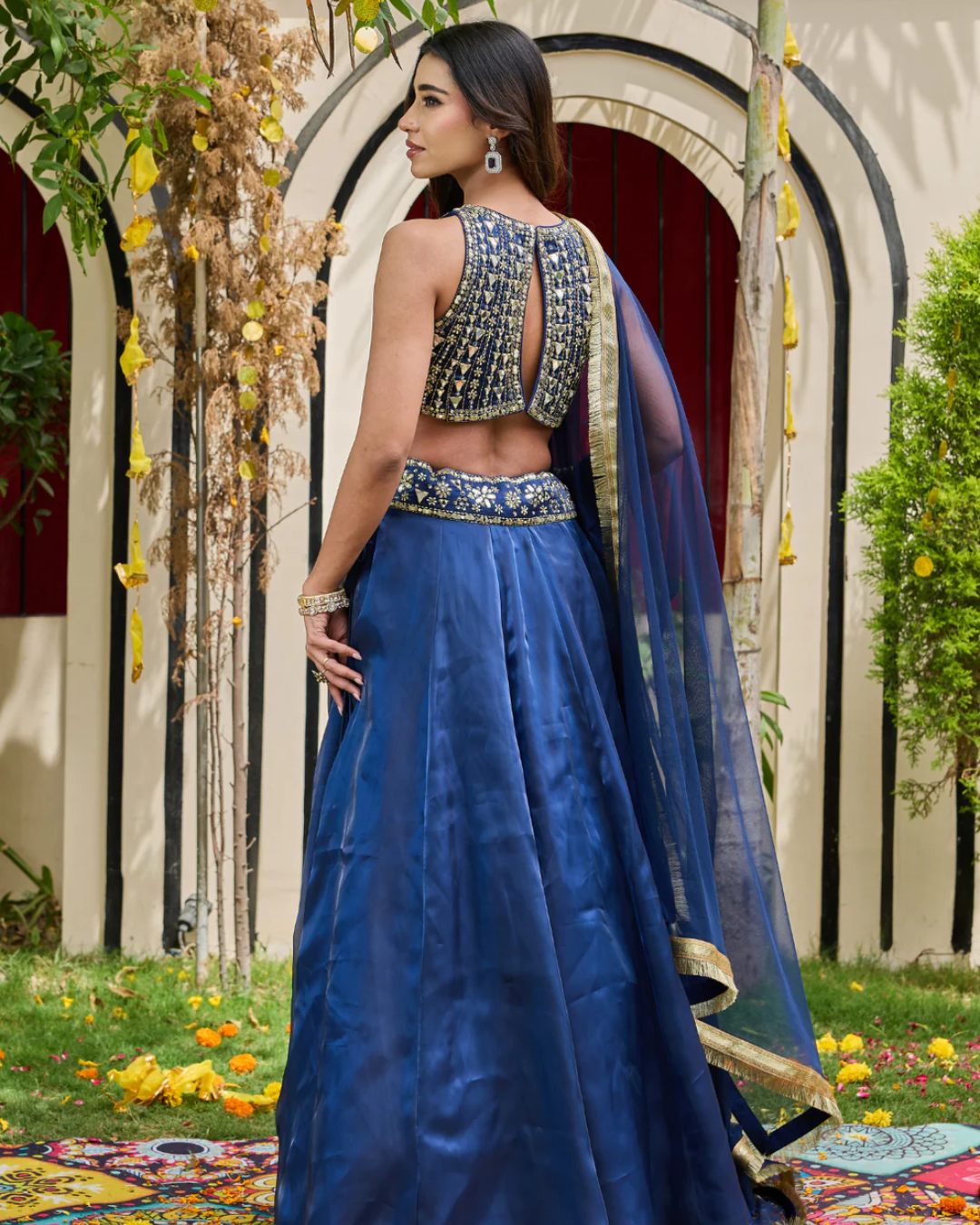 Deepika Chadha - Navy blue blouse and shimmer organza lehnga set From Heer