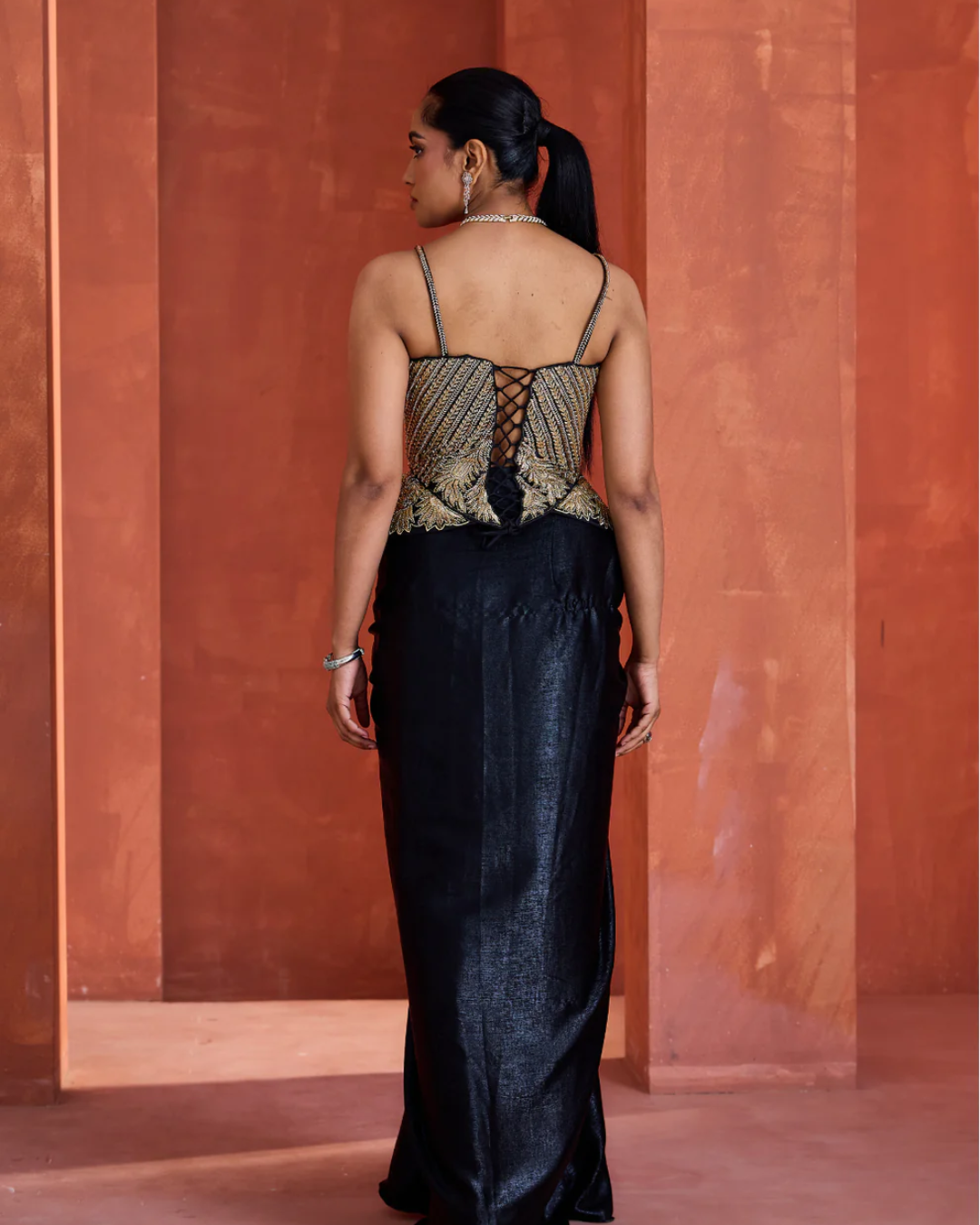 Deepika Chadha - Black drape skirt gold corset From Midnight