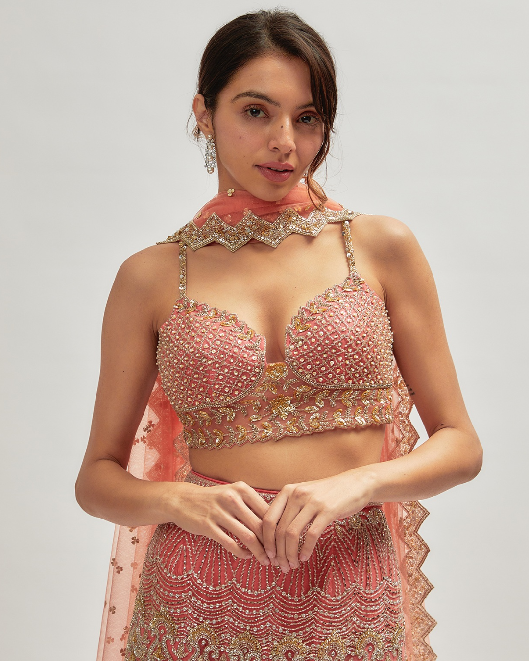 Isa by Dolly Wahal - Coral Pink Net Embroidered Fish-Cut Lehenga Set
