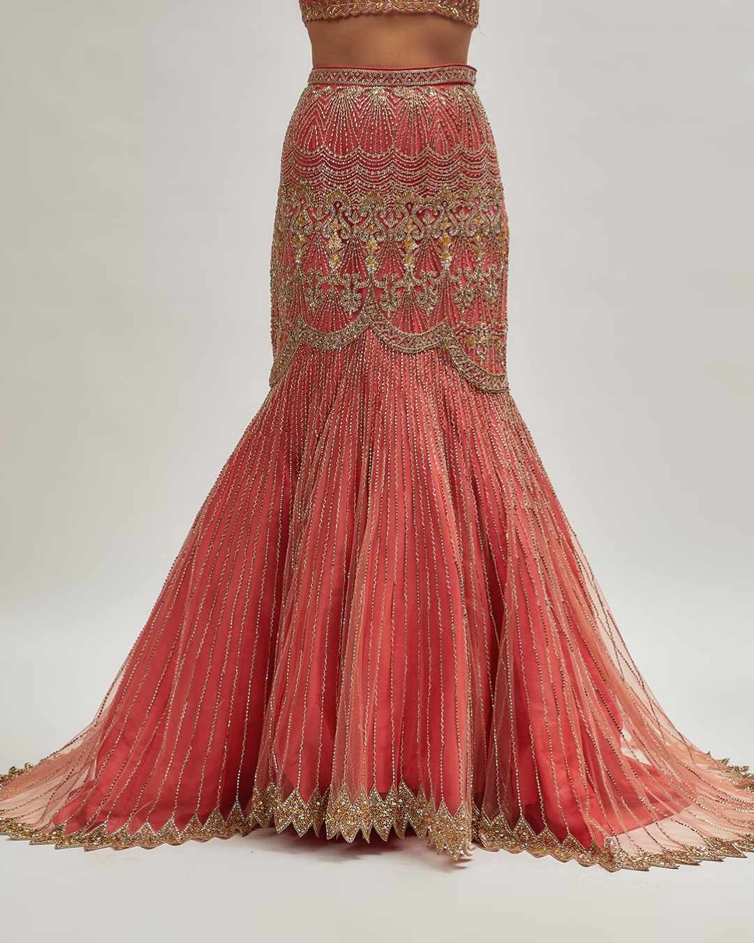 Isa by Dolly Wahal - Coral Pink Net Embroidered Fish-Cut Lehenga Set