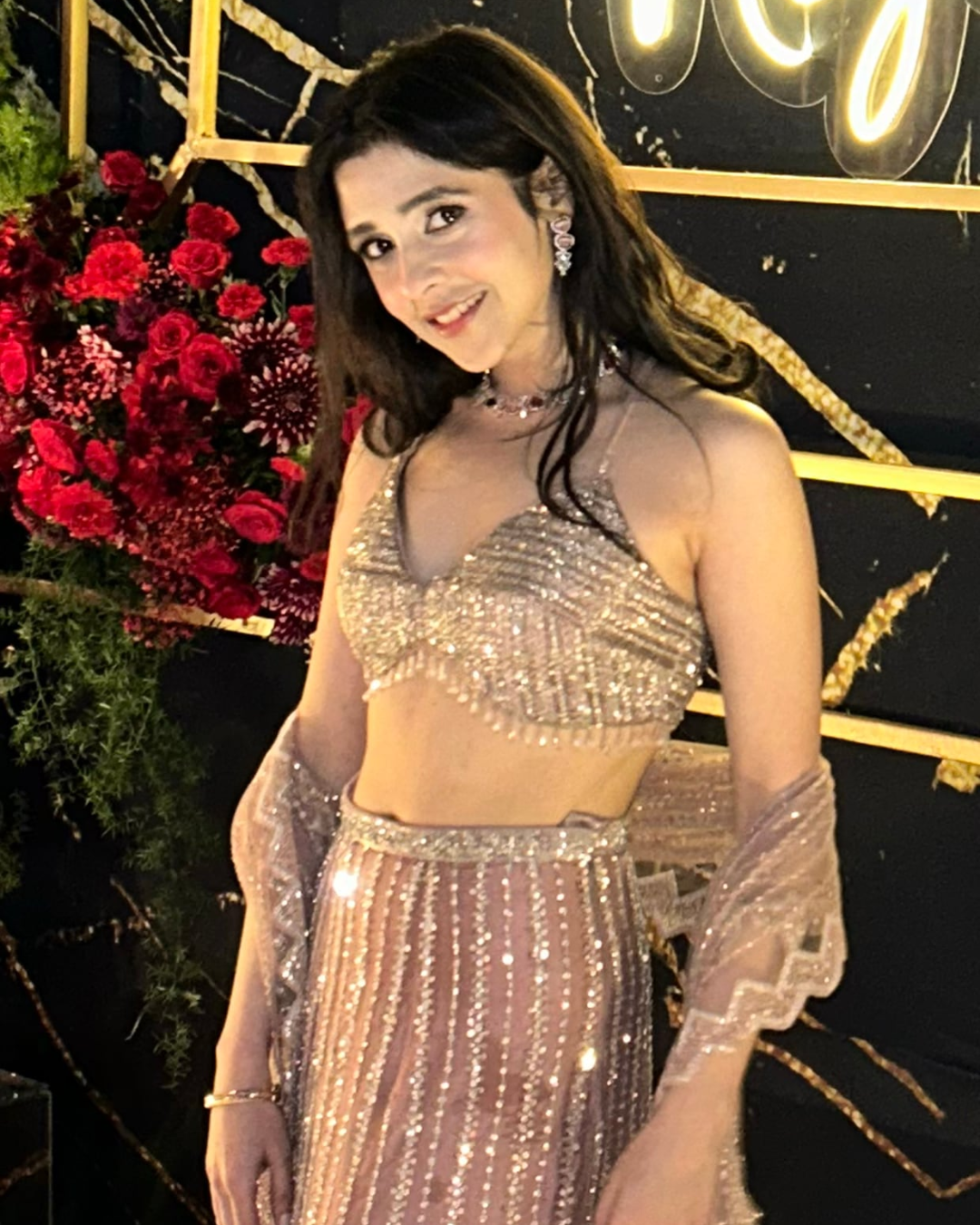 Isa by Dolly Wahal - Champagne Pink Net Sequins Embroidered Pre-Draped Saree Set