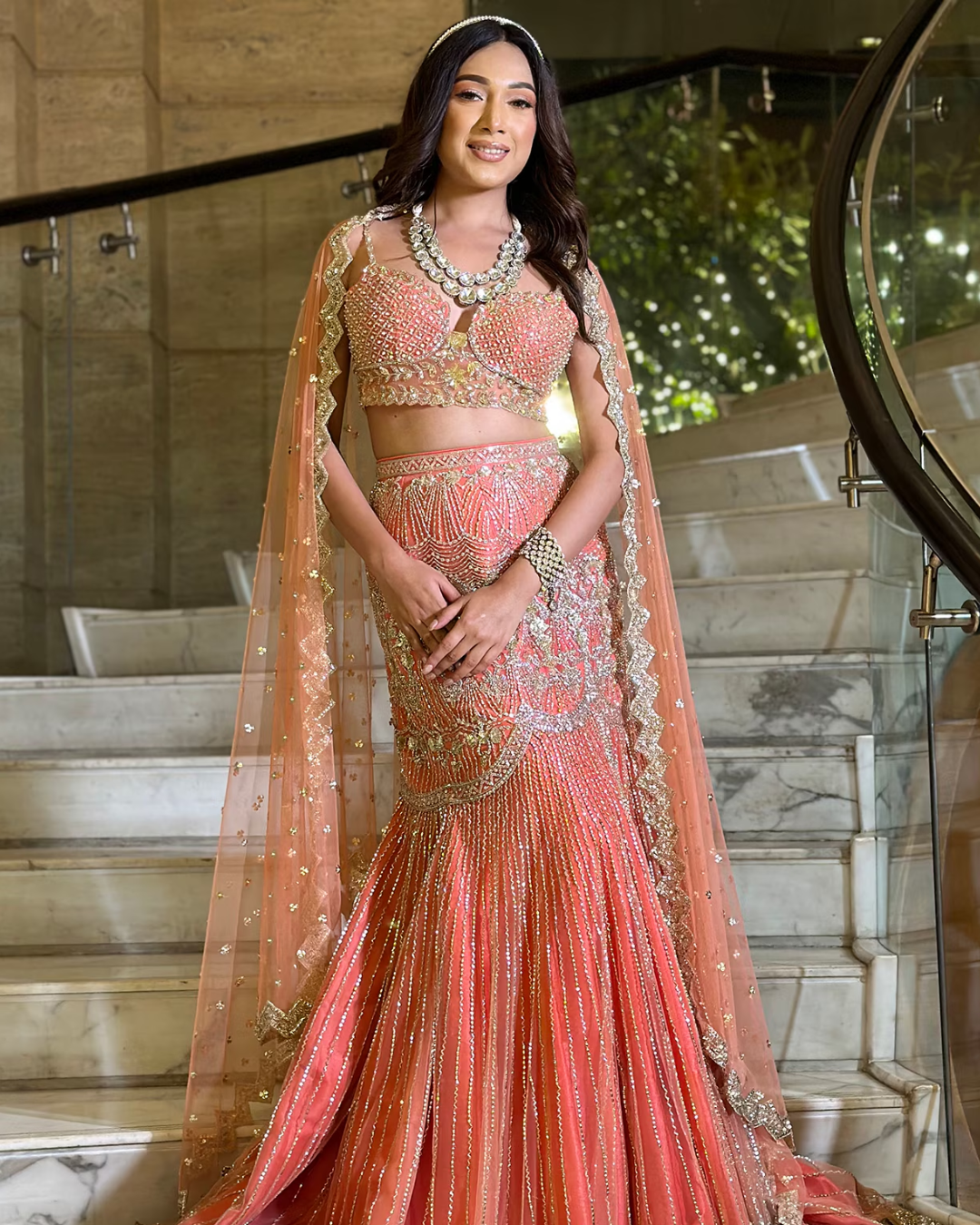 Isa by Dolly Wahal - Coral Pink Net Embroidered Fish-Cut Lehenga Set