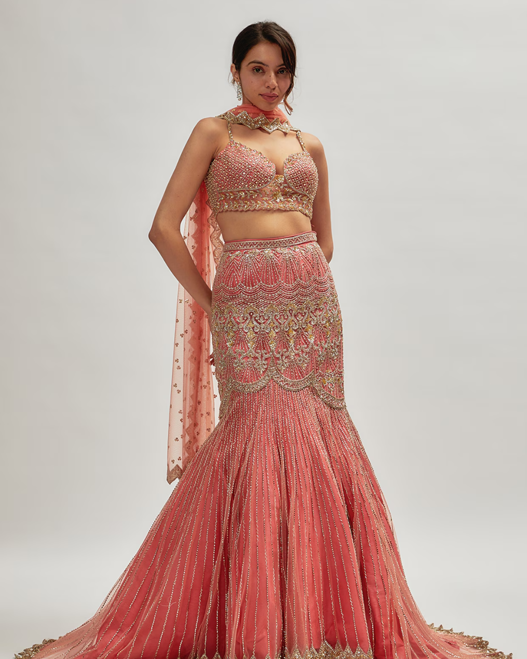 Isa by Dolly Wahal - Coral Pink Net Embroidered Fish-Cut Lehenga Set