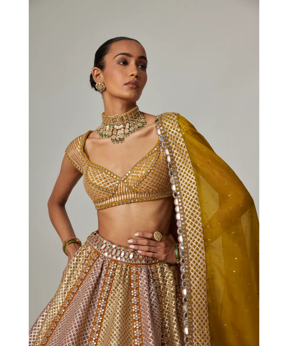 VVANI VATS - Mustard multicolor Heavy Metallic Lehenga with green Dupatta