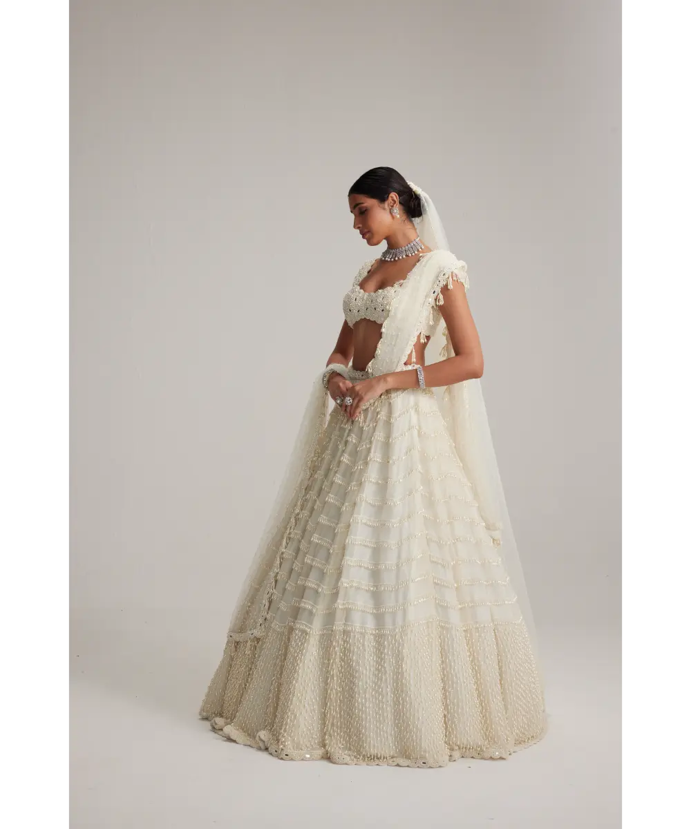 VVANI VATS- Off White Mirror and Pearl Drop Bridal lehenga set with Veil