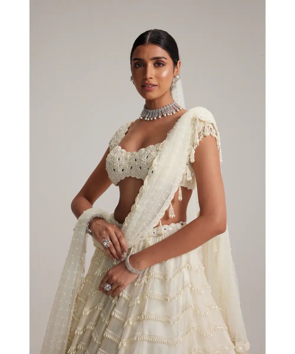 VVANI VATS- Off White Mirror and Pearl Drop Bridal lehenga set with Veil