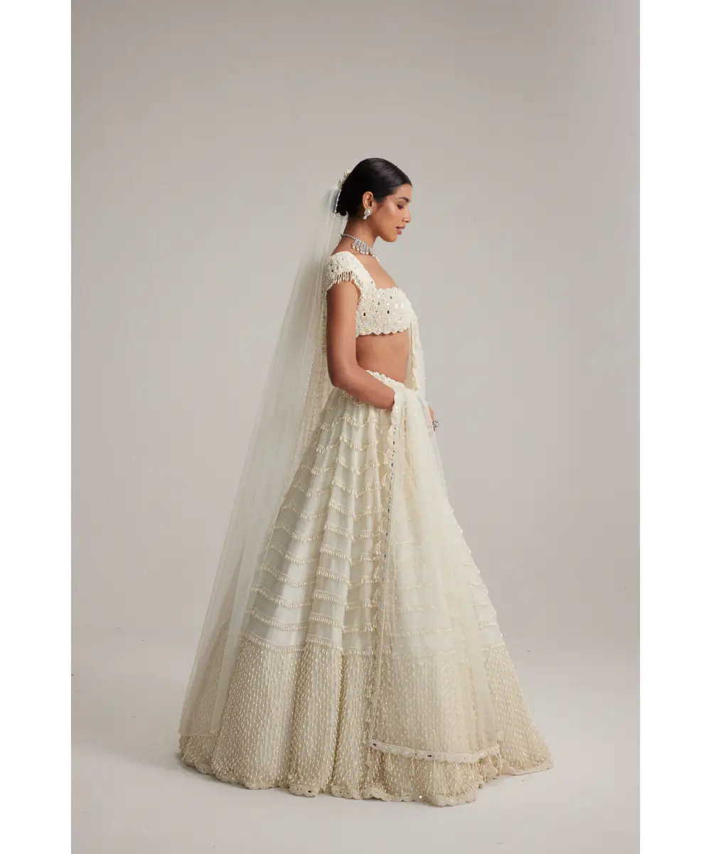 VVANI VATS- Off White Mirror and Pearl Drop Bridal lehenga set with Veil