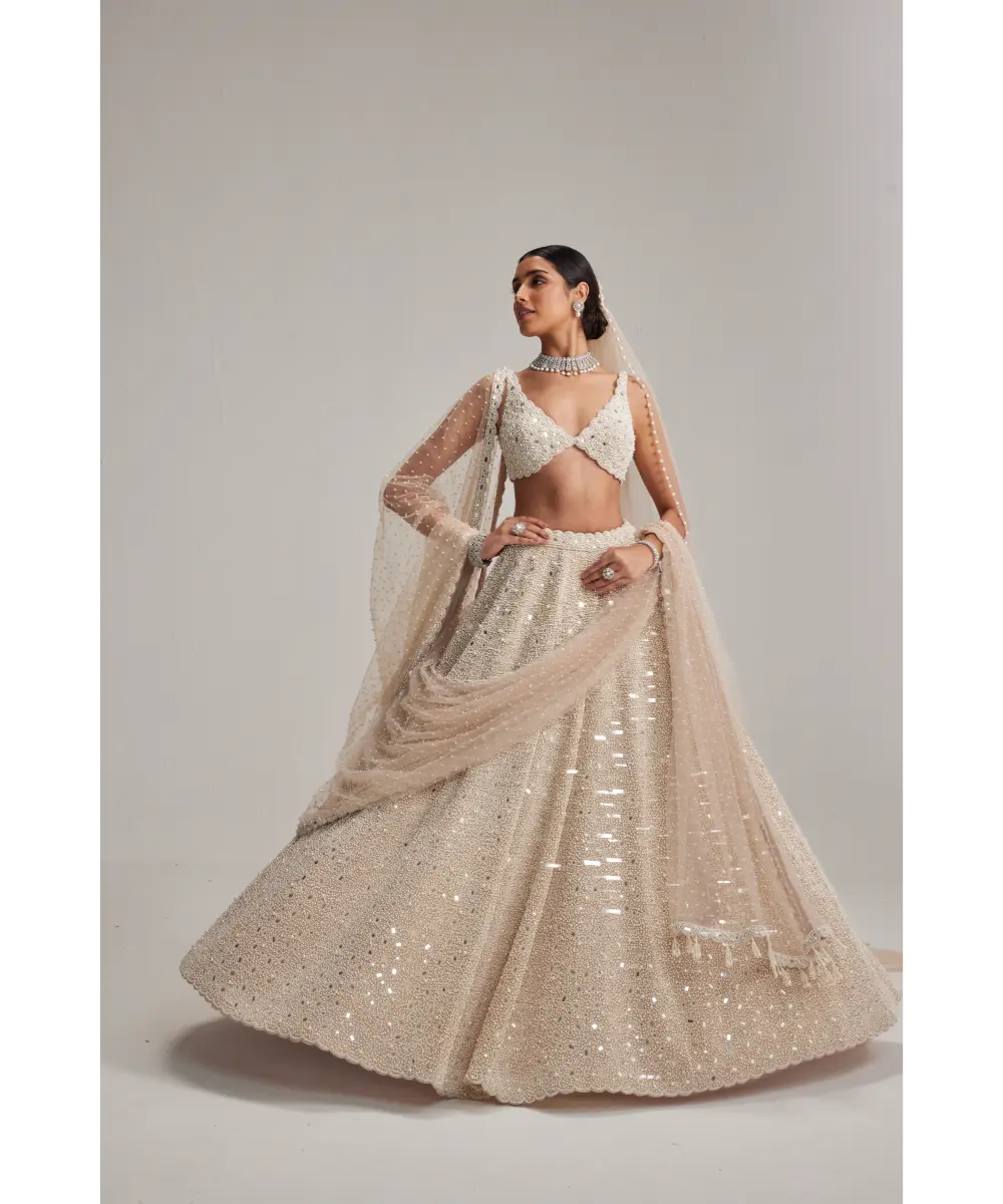 VVANI VATS- Light Beige Dense mirror and pearl lehenga set with Double Dupatta and Veil