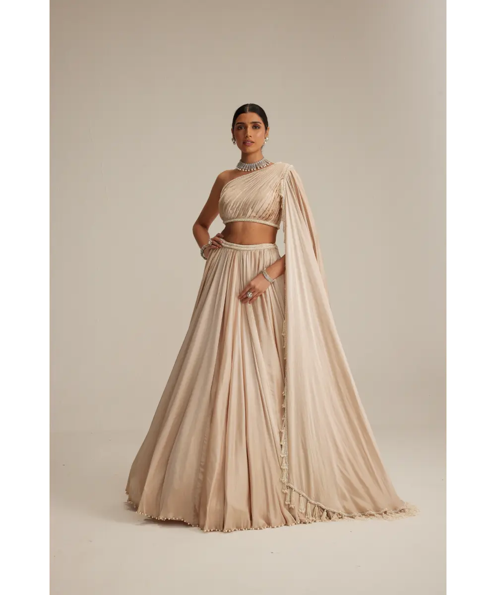 VVANI VATS- Light Beige Dense mirror and pearl one shoulder lehenga set