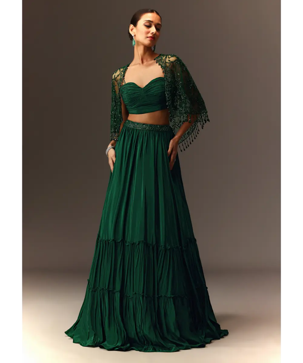 KALKI - Bottle Green Tiered Lehenga With Net Cape