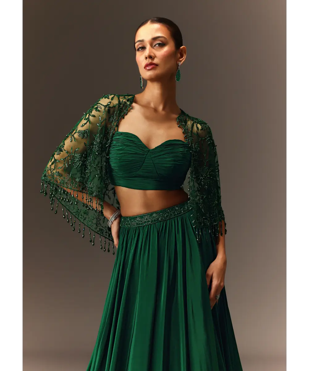 KALKI - Bottle Green Tiered Lehenga With Net Cape