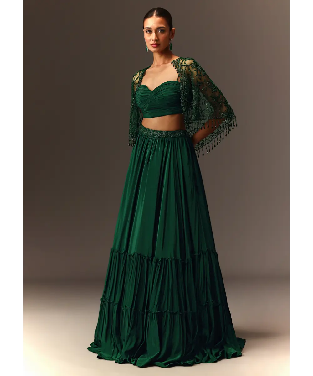 KALKI - Bottle Green Tiered Lehenga With Net Cape