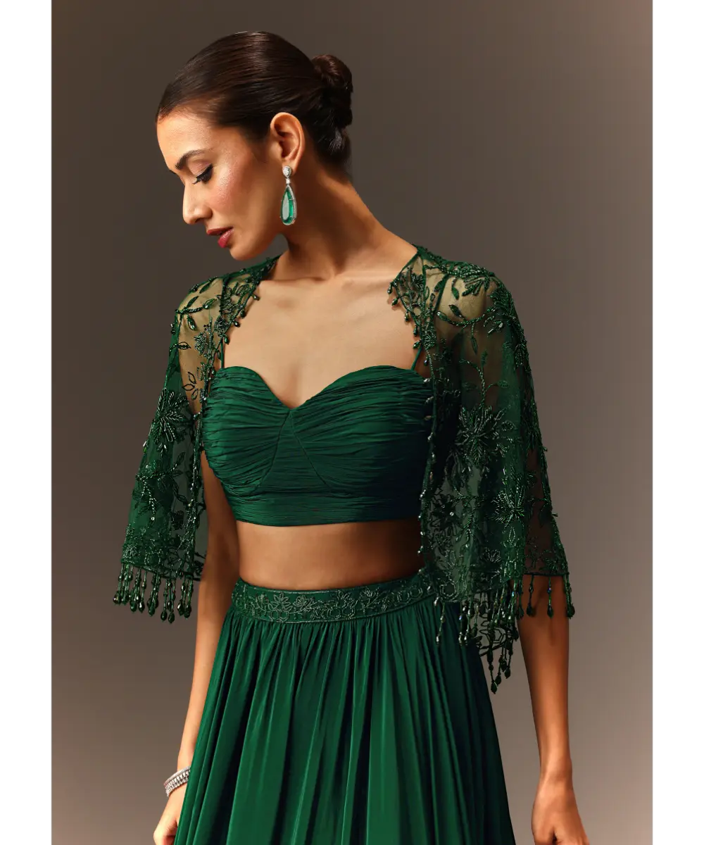 KALKI - Bottle Green Tiered Lehenga With Net Cape