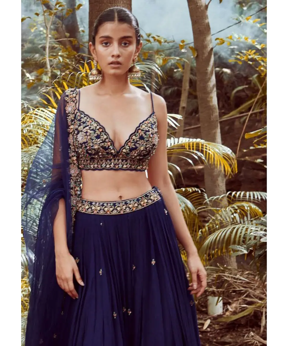 KALKI - Blue blood Lehenga Choli With Hand Embroidered Crop Top Using Sequins And Beads In Floral Jaal Design